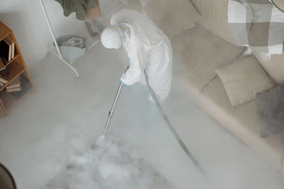 Biohazard cleanup technician in protective equipment, Glasgow, KY